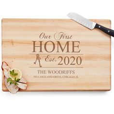 a personalized cutting board with a knife and garnish on the side that says our first home est 2020