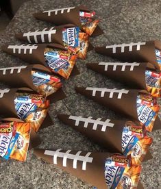 football shaped candy wrappers sitting on top of a counter