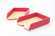 two red trays sitting on top of each other