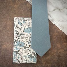 This Handcrafted Accessory Set Is Perfect For Formal Events Such As Weddings, Holiday Parties, Religious Ceremonies, Proms Or Even A Romantic Anniversary Date - An Excellent Gift For Any Gentleman That Enjoys Dressing Up Dapper For Special Occasions! Includes: (1) Solid Textured Necktie / 100% Cotton / Slim (2.5” Width) / Approx. Length 58”/ Dry Clean Only (1) Floral Print Pocket Square 100% Cotton / Approx. 12”X 12”/ Dry Clean Only Thank You! White Tie Groom, Mens Wedding Ties, Floral Pocket Square, Blue Necktie, Groom Ties, Romantic Anniversary, Floral Pocket, Anniversary Dates, Handcrafted Accessories