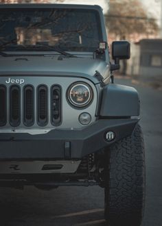 the jeep is parked on the side of the road