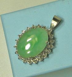 Excellent condition. This was a ring that we converted into a pendant. Jadeite jade surrounded by two levels of single cut diamonds. Jadeite measures approx. 20.4 x 14.8 x 2.7mm.  Pendant weighs 9.3 grams and measures approx. 25 x 22mm. Chain not included. Oval Green Diamond Gemstones, Elegant Oval Cabochon Jade Jewelry, Green Pendant Gemstones For Formal Occasions, Formal Cabochon Chrysoprase Jewelry, Exquisite Jade Jewelry For Formal Occasions, Jade Jewelry With Polished Finish For Anniversary, Exquisite Jade Jewelry For Anniversary, Anniversary Jewelry In Polished Jade, Anniversary Jade Jewelry With Polished Finish