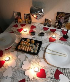 a table topped with plates and bowls filled with food