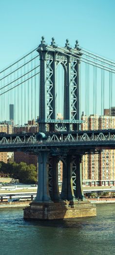 the bridge is very tall and has many cables