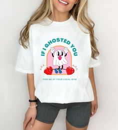 ️👻IF I GHOSTED YOU, FIND ME AT YOUR LOCAL GYM👻❤️🏋🏽 We may all be guilty of ghosting, or victims of being ghosted 😭 Either way, you know you'll be in the gym repping out your sadness and pushing through your tears! This shirt is a cute retro design for anybody who would rather be at the gym than their own home 💗 👕ABOUT THE SHIRT👕 The unisex heavy cotton tee is the basic staple of any wardrobe. It is the foundation upon which casual fashion grows. The specially spun fibers provide a smooth surface and there are no side seams mean there are no itchy interruptions under the arms. The shoulders have tape for improved durability. - 100% cotton (fiber content may vary for different colors) - Medium fabric (5.3 oz/yd² (180 g/m²) -Classic fit -Tear-away label - Runs true to size - Unisex si Funny Crew Neck Gym Tops, Funny Gym Tops With Crew Neck, White Sports Tops With Front Print, White Sports Top With Front Print, Fun White Sports T-shirt, Funny Letter Print Gym Tops, Sporty White Tops With Funny Print, White Slogan Top For Workout, Cute Short Sleeve Sports Tops