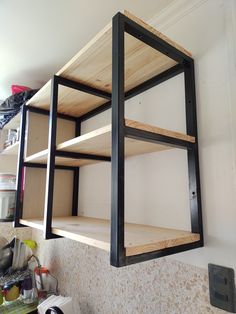 the shelves are made out of plywood and have metal brackets on each side to hold items