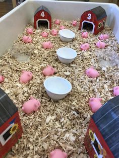 pigs are eating out of their food bowls