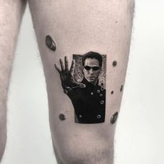 a man's leg with a black and white photo of him on the side