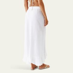 Melissa Odabash "Danni" coverup skirt with ruffle trim. Wrap-style with side ties. A-line silhouette. Cutaway hem. Midi length. Rayon. Imported. Flowy Beach Maxi Skirt With Lining, Flowy Lined Maxi Skirt For Beach, Chic Tiered Maxi Skirt For Beach, Flowy Tie Waist Tiered Skirt, Flowy Maxi Skirt With Tie Waist, Flowy Tiered Skirt With Tie Waist, Flowy Long Skirt With Ruffle Hem, Flowy Long Skirt For Vacation, Breezy Ruffled Maxi Skirt For Summer