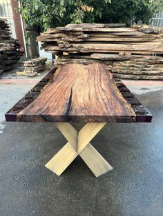 a wooden table sitting on top of a parking lot