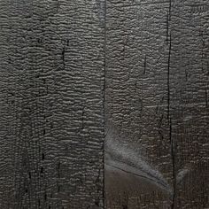 the texture of an old wooden wall with peeling paint