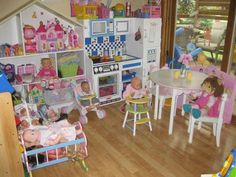 a child's play room filled with toys and dolls