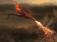 a red dragon flying through the air over a field