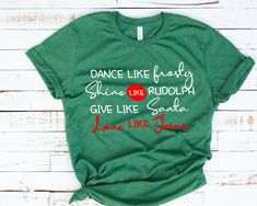 a green t - shirt that says dance like fairy shine like rudolph give like santa