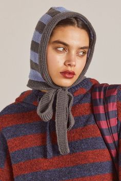 Lean into the season with a knitted Damson Madder bonnet in wintry grey and blue stripes. • Bow at neck• One size fits all• Designed in London• 100% Recycled Polyester