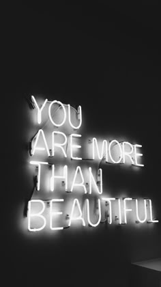 a neon sign that says you are more than beautiful