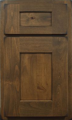 a close up of a wooden cabinet door