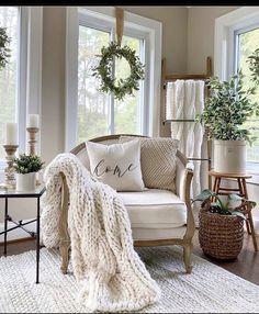 a living room filled with furniture and lots of plants on the windows sills