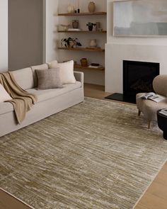 a living room filled with furniture and a fire place in the middle of the room