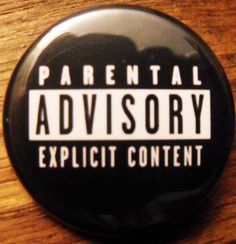 a black and white button with the words, parental advisory explicit content on it's side