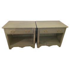 two nightstands side by side with one drawer open and the other closed on both sides