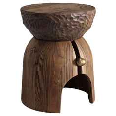 a wooden stool with metal knobs on the top and wood grained finish to it