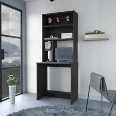 a black and white desk with a computer on it