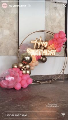 a balloon arch with the words happy birthday on it