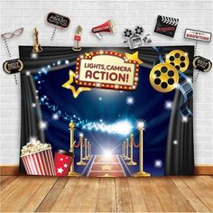 an image of a stage set up for a movie event with popcorn, film reels and other decorations