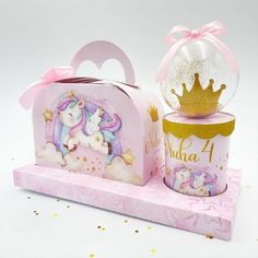 a pink box with a unicorn on it and a glitter ball in the shape of a princess's castle