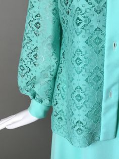 True vintage item description: Darling vintage 70s mint green 2 piece maxi dress and matching jacket. Dress is sleeveless with zip up back, lined bodice. The dress is size 14 and measures bust 36 waist 28 hips are free and is 54 inches long. The jacket with long poet sleeves, buttons up front. The fabric is all polyester. The dress is in excellent mint ready to wear condition. We value and appreciate your business and we prove it! Please enjoy our customer satisfaction guarantee. Much love! A fe Green Lace Maxi Dress With Lace Trim, 1970s Style Vintage Dress With Lace Trim For Spring, 1970s Style Green Floral Print Dress, 1970s Green Long Sleeve Dress, 1970s Spring Vintage Dress With Lace Trim, 70s Clothing, 70 Fashion, Lace Jacket, Button Up Dress