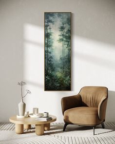 a chair and table in a room with a painting on the wall above it,