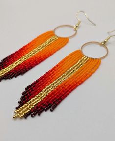 Beautiful sunset colors that will definitely stand out! Seed Bead Earring Patterns, Bead Earring Patterns, Seed Bead Earring, Seed Beads Jewelry, Diy Seed Bead Earrings, Beaded Work, Bead Fringe, Bead Earring, Beaded Earrings Patterns