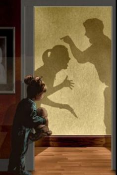 the shadow of a man and woman in front of a door