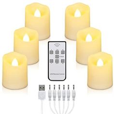 five lit candles with remote controls and cords