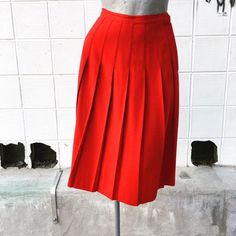 Waist 26 inchesLength 26 inchesBeautiful, bright red. Excellent condition. Unlined. Wool. Classic Red Skirt, Red Knee-length Pleated Skirt For Spring, Red Retro Pleated Skirt, Red High Waist Lined Pleated Skirt, Red High Waist Pleated Skirt With Lining, Red High Waist Pleated Skirt, High Waist Red Pleated Lined Skirt, Red Pleated High-waist Skirt, Red Pleated Knee-length Skirt