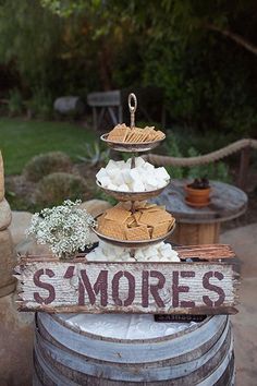 there is a sign that says s'mores on it next to some wine barrels