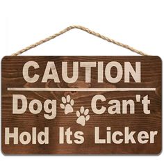 a wooden sign that says caution dog can't hold it's licker