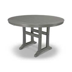 an oval dining table with four legs