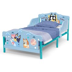 a child's bed with cartoon characters on it