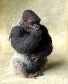 a stuffed gorilla sitting on its hind legs