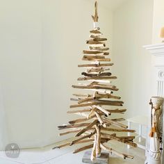 a christmas tree made out of wood sticks