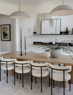 a dining room table with six chairs around it