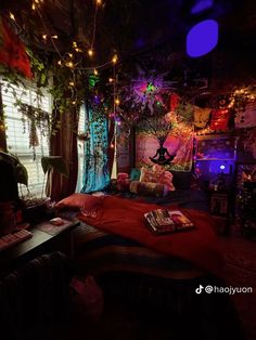 a bed room with a neatly made bed and lots of lights hanging from the ceiling