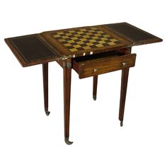 a wooden table with two drawers and chess board on the top one drawer is open