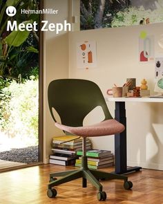 a green chair sitting on top of a hard wood floor