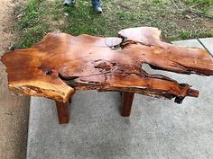 a piece of wood sitting on top of a sidewalk