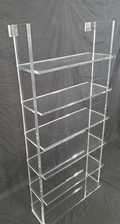 clear acrylic shelving unit with six shelves