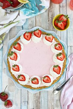 a strawberry cream pie with fresh strawberries on top