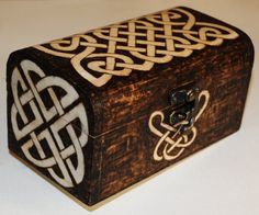 a wooden box with intricate designs on it